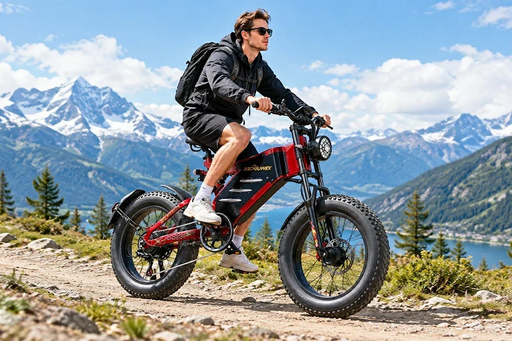 Man riding RZOGUWEX X7 electric bike on mountain trail, snow mountains and lake background